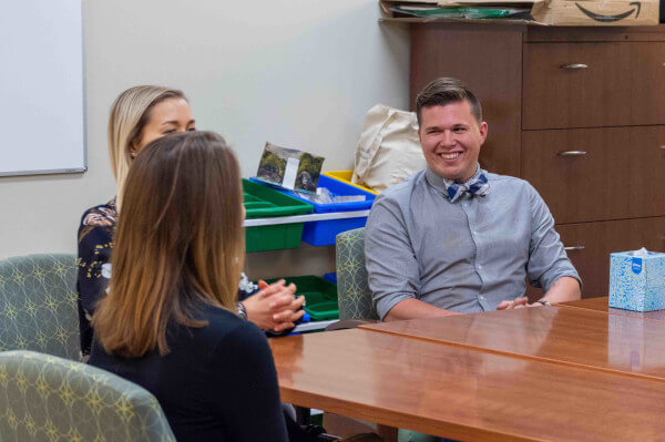 Students talk in a group setting