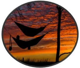 Person in hammock enjoying the sunset.